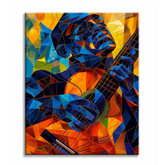 A guitar player paint by numbers design showing a musician and his instrument built from blue and orange geometric facets.