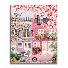 Cherry blossom hangs over a pink and lilac townhouse street with window boxes and a small pink car, in a paint by numbers design.