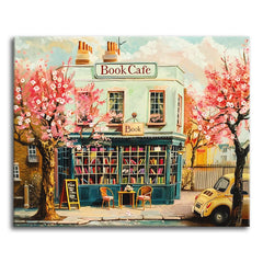 A paint by numbers corner book cafe with a teal storefront, shelves of books, pink cherry blossom trees, and a small yellow car at the curb.