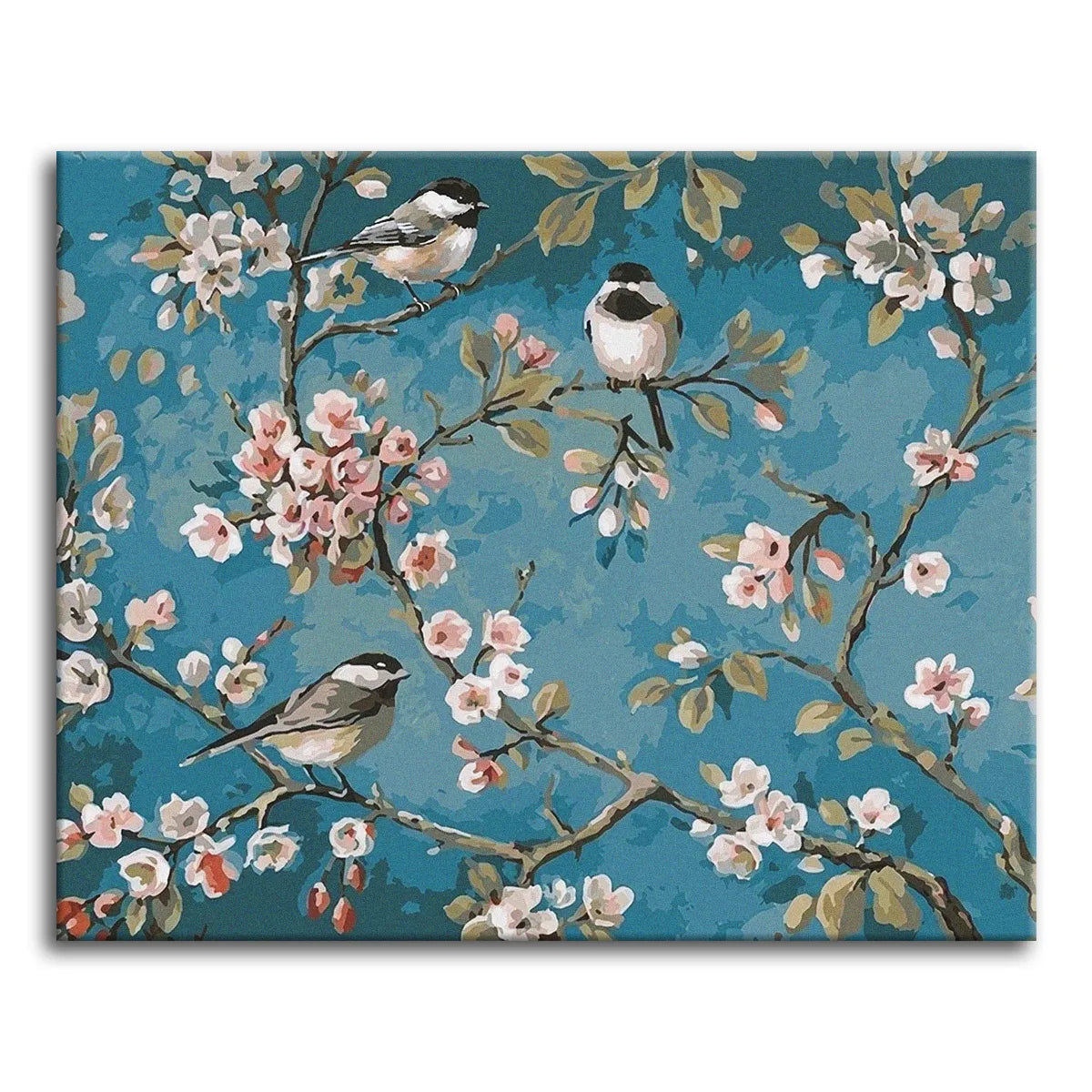 Three chickadees perched among blossoming branches against a muted teal background in a classic chinoiserie style, shown as a paint by numbers canvas.