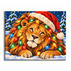 Colored Christmas lights wrap through a lion's golden mane in a Christmas lion paint by numbers design, beneath a red Santa hat and against snowy fir trees.