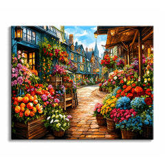 A cobbled lane paint by numbers design showing crates and barrels of red, blue and yellow flowers lining both sides of a street of timbered houses.