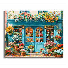 At a turquoise storefront, a flower shop paint by numbers design fills window boxes, display shelves, and sidewalk pots with pink, orange, white, and blue blooms.