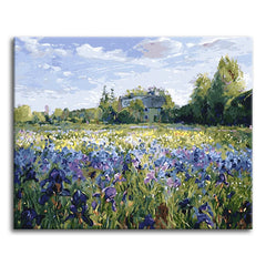 An impressionist paint by numbers scene of a blue and violet iris field stretching toward a country cottage beneath a cloud-scattered summer sky.
