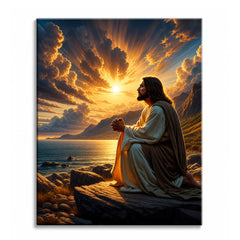 A paint by numbers canvas of Jesus kneeling in prayer on a rocky shore, face lifted to a radiant golden sunrise over the sea and mountains.