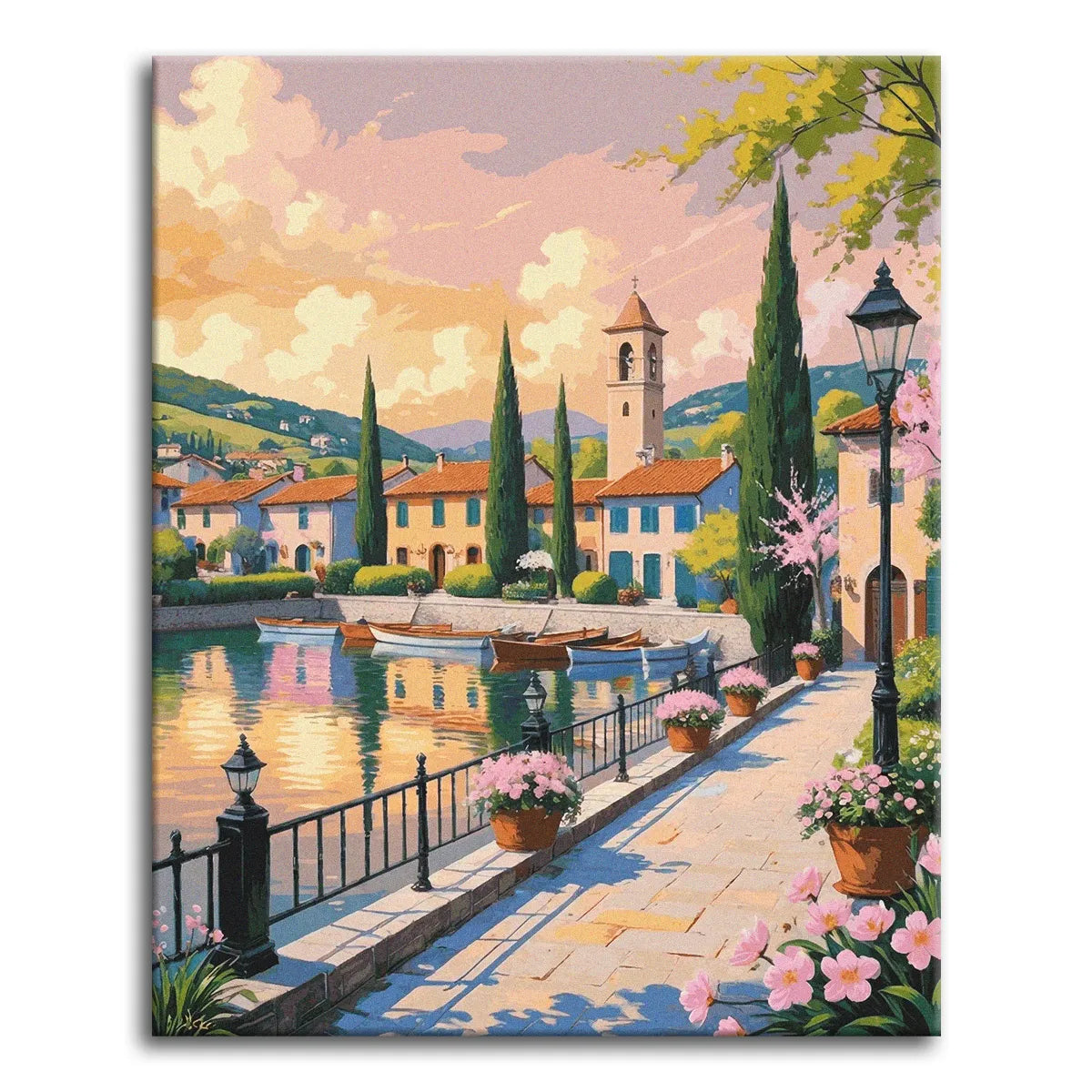 A paint by numbers canvas of a flower-lined lakeside promenade at sunset, with moored rowboats, pastel houses, cypress trees, and a bell tower by still water.