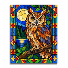 A stained glass owl paint by numbers design showing a brown-and-amber owl perched on a branch beside a full moon, dark pines, green leaves, and a reflective lake within a blue leaded border.