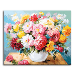 A full bouquet of pink, white, yellow, and red flowers overflowing from a round white vase on a sunlit table, shown as a paint by numbers canvas.
