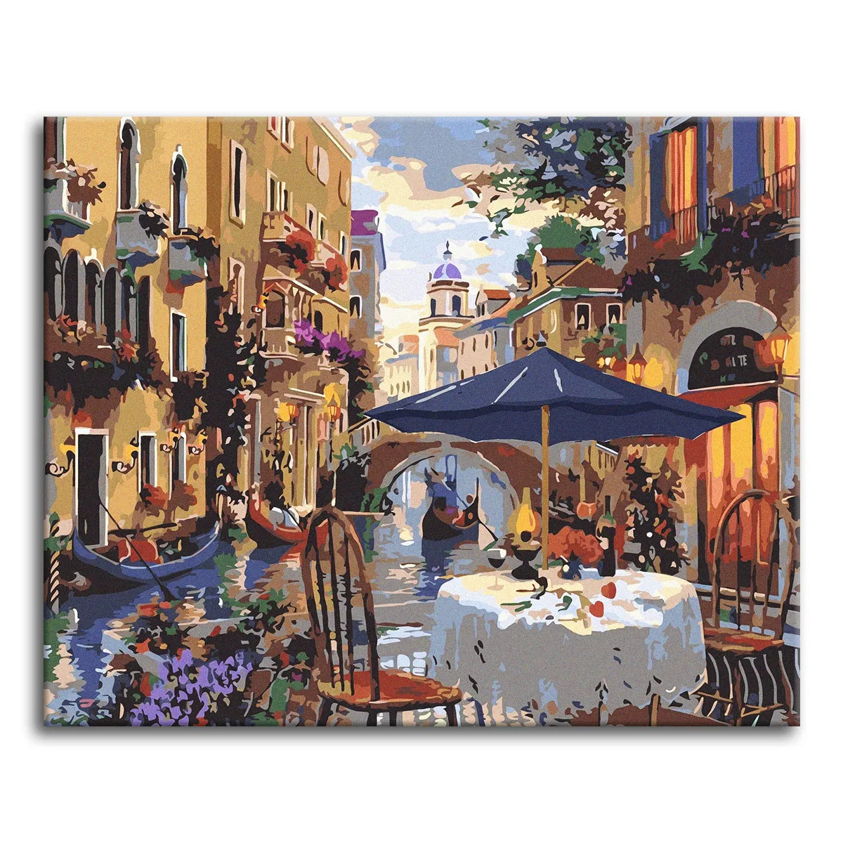 A paint by numbers canvas of an evening café terrace beside a Venetian canal, with a candlelit table, moored gondolas, and warmly lit buildings at dusk.