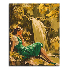 A romantic vintage illustration-style paint by numbers scene of a woman in a flowing green dress reclining on a rock beside a woodland waterfall, surrounded by golden dappled foliage.